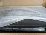 a bed in a box with a sheet covering it