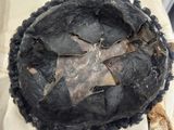 a close up of a dirty pie crust on a table