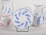four different types of blue and white vases and plates