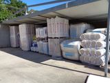 a lot of bags of toilet paper in the back of a truck