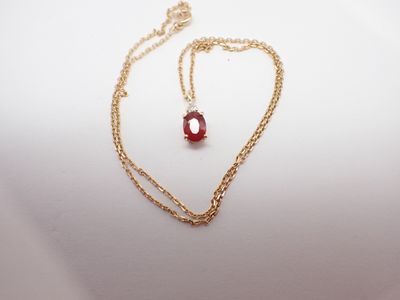 Chaine et pendentif en or orné d'une spessartite et d'un petit diamant - Photo 1