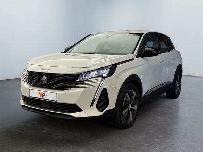 a white car is parked in a large room with a black floor