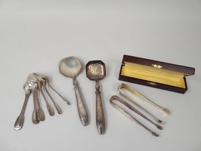 five spoons and two spoons and a box on the table