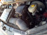 the engine of a car with its hood open and the hood down