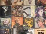 a lot of cds on the wall of a room