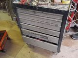 a workbench with many tools on it in a garage
