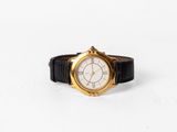an image of a close up of a wrist watch on a white surface