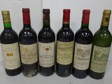 six bottles of wine are lined up in a row on a table