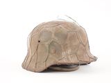 a helmet that is made out of clay and wire