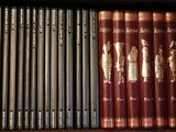 many books on a shelf in a book case