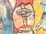 un tableau accroché au mur représentant un homme avec un chapeau rouge