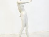 white marble statue of a woman holding a flower in her right hand