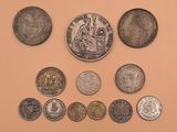 a lot of coins that are on the table