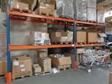 many boxes on the shelves in the warehouse
