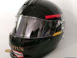 a helmet with a sticker on it sitting on a table
