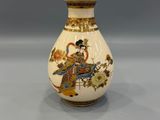 a vase that has a picture of a woman on it