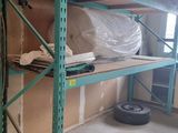 a room that has a shelf with a lot of items on it