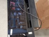 an image of a broken tv sitting on the floor