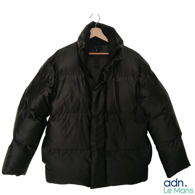 a black jacket on a hanger on a white background