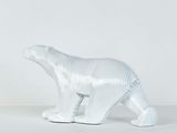 sculpture of a white polar bear on a white surface
