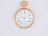 a gold pocket watch with roman numerals on the face