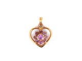 un pendentif en forme de cœur en or, orné d'une pierre rose en son centre