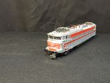 a toy train that is sitting on a black surface
