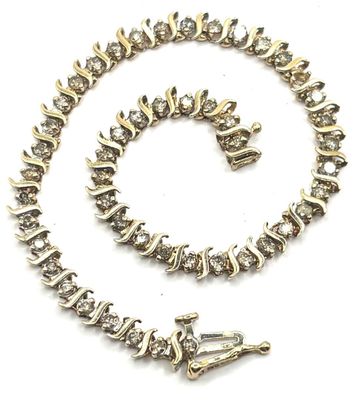 Bracelet ligne en or jaune 10 carats agrémenté de 48 diamant…