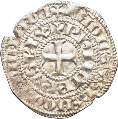 un gros plan d'une pièce de monnaie avec un visage dessus