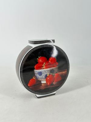 a picture of a bowl of strawberries on a table