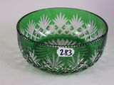 an image of a green glass bowl sitting on top of a table