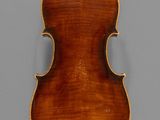 an old violin with a wooden back and a long neck