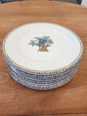 a stack of plates sitting on a wooden table