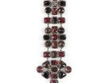 a close up of a necklace on a white background