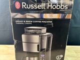 a box of russell hobbs coffee machine sitting on top of a wooden table