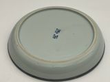 a white plate with a blue and white design on it