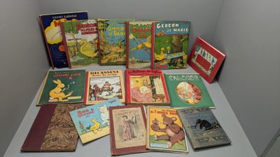 many children ' s books sitting on a white table