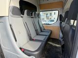 four seats in the back of a van that is empty