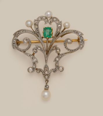 an antique emerald and pearl broochle