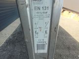 a parking meter on the side of the road