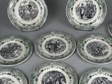 six green and white plates with black and white designs on them