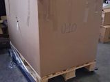 a large box sitting on a pallet in a warehouse