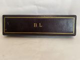 a close up of a black book with gold lettering on it