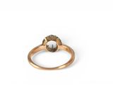 an image of a close up of a ring on a white surface