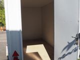 a white truck with a door open on the side of the road