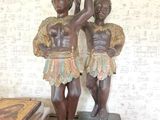 a statue of two men standing next to each other