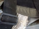 a label on the seat belt of a car seat