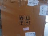 a brown box with stickers on it sitting on the floor