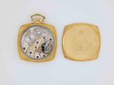 an image of a gold pocket watch with a white background