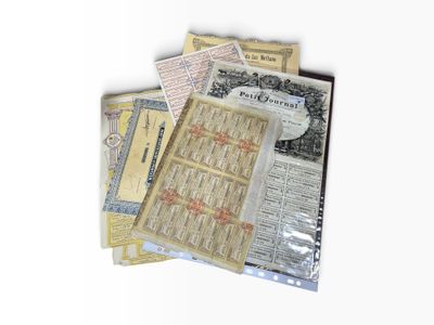 a pile of old and new currency sitting on a table